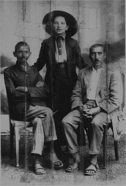 Gandhi, Sonia Schlesin, his secretary, and Dr. Hermann Kallenbach. Kallenbach sewed this photo in the collar of his jacket before joining Gandhi in England during the First World War. Being of German origin, he feared being arrested and the image seized. He was effectively arrested, but the police never discovered the photo. 1913.