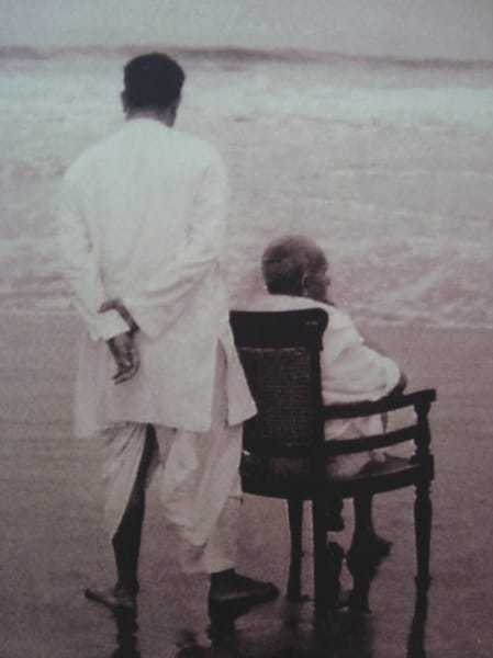 Gandhi with his son Devdas at Juhu Beach, Mumbai, Maharashtra, India. May 1944.