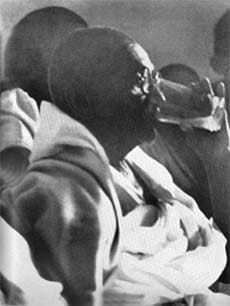 Gandhi breaking his fast. Delhi. January 18. 1948.