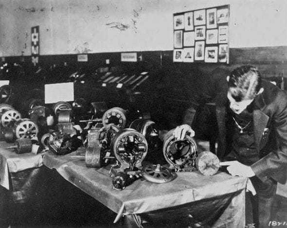 Tesla with some of his induction motors.