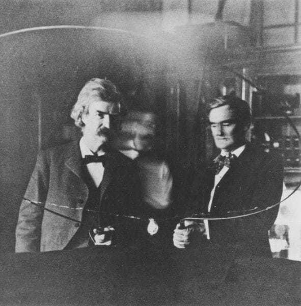 Mark Twain and Joseph (“Jo”) Jefferson in Tesla's South Fifth Avenue laboratory, 1894, with blurred image of Tesla between.