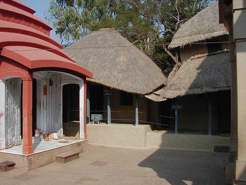 The Hut at Kamarpukur where Ramakrishna was born: The small house at Kamarpukur where Ramakrishna lived (centre). The family shrine is on the left, birthplace temple on the extreme right (from the original)