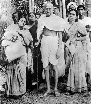 Mahatma Gandhi with Abhaben Gandhi during his tour of Bengal province in 1946.