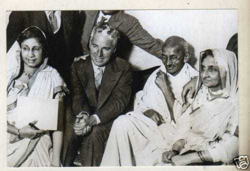 Charlie Chaplin with Mahatma Gandhi in Canning Town, London, 1931.