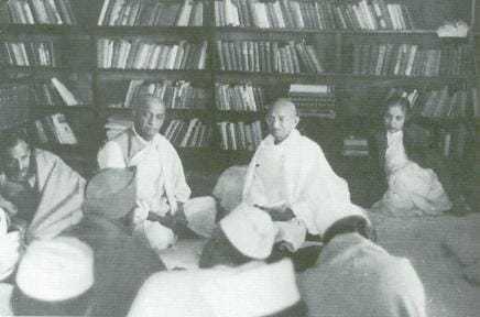 Gandhi attends a Congress Working Committee meeting at Anand Bhavan in Allahabad, Vallabhbhai Patel to the left, Madame Vijaya Lakshmi Pandit to the right.