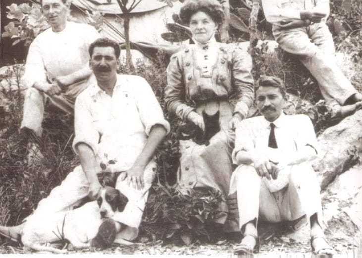 Mahatma Gandhi, Dr. Hermann Kallenbach (with dog), Devadas Gandhi (Gandhi's son, right) and others in front of "The Tent" at the living quarters orchards of Tolstoy Farm near Johannesburg, South Africa, ca. 1910