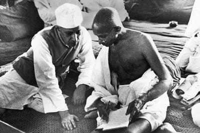 Pandit Nehru and Mahatma Gandhi during the All-India Congress Committee session, Bombay, August 8, 1942, when the "Quit India" resolution was adopted, calling for the immediate dissolution of British rule. The following morning, British authorities arrested Gandhi and Nehru, along with other top Indian political leaders. 8 August 1942.