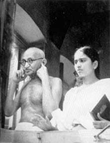 Gandhi plugging his ears against the deafening din of the demonstrators before his Beliaghat residence at Calcutta, August 15, 1947
