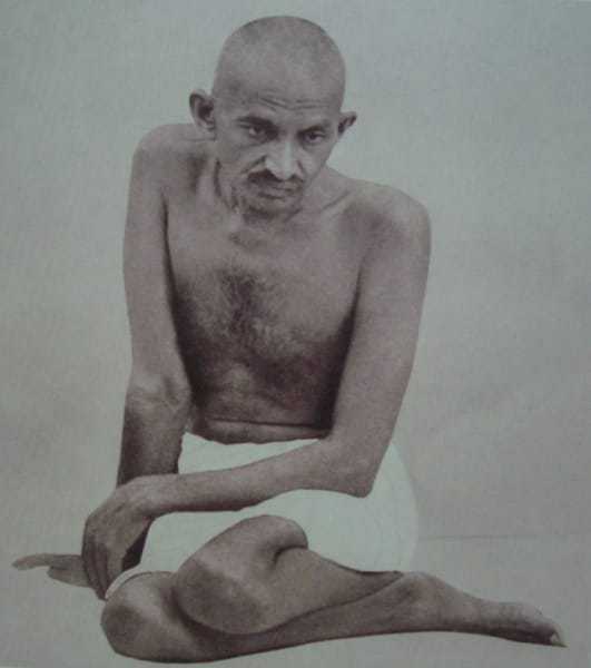 Mohandas Gandhi in a characteristic pose, 1924.