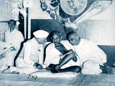 Pandit Jawaharlal Nehru Mahatma Gandhi and Sardar Patel at a special session of the All India Congress Committee to consider a proposal for the formation of Congress. 1933.