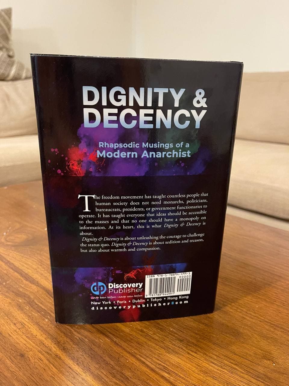 Sterlin Lujan with Book Dignity and Decency